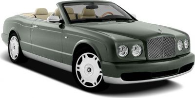 Luxury convertible with chrome grille and beige interior