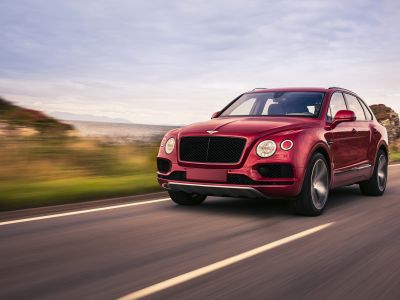 Luxury SUV front view with distinctive grille and round headlights