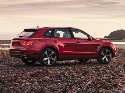 Luxury SUV side view with sleek design and distinctive alloy wheels