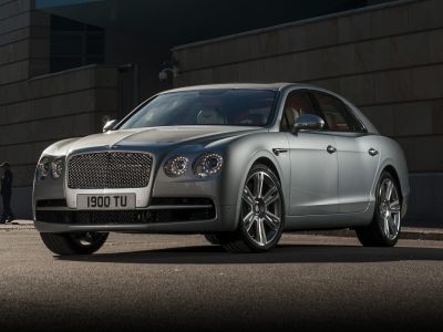 Luxury sedan with matrix grille and quad round headlights