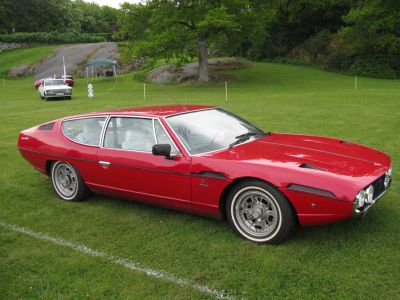 Classic coupe with sleek body and distinct quad circular front headlights
