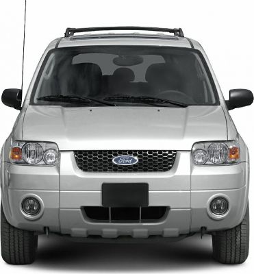 Front view showing grille, headlights, fog lamps, and roof rack.