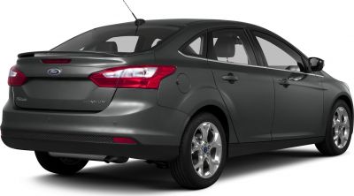Rear side view with alloy wheels and subtle spoiler