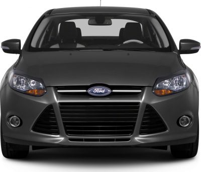 Front view showcasing headlights, grille, and fog lights of a sedan.