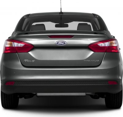 Rear view of a sedan showing taillights, rear window, and exhaust pipe