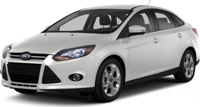 Front view of white sedan with headlights and alloy wheels