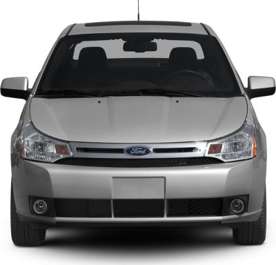 Front view of car with chrome grille and fog lights