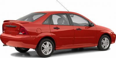 Red sedan with rear spoiler and alloy wheels, side and rear view