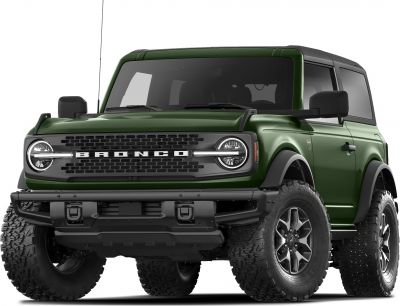 Front view of green off-road SUV with rugged tires and bold grille