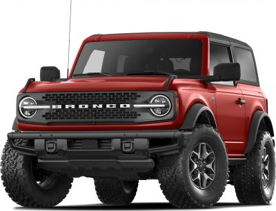 Red two-door off-road SUV front with rugged tires and round LED headlights