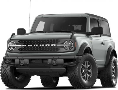 Rugged two-door SUV front with round headlights and large off-road tires