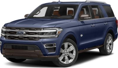Front side view of a blue large SUV with distinctive grille and alloy wheels