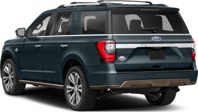 Rear side profile of a full-size SUV with distinctive tail lights and roof rails