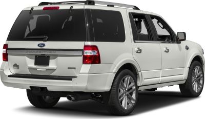 Rear view of large SUV with tinted windows, alloy wheels, and roof rails