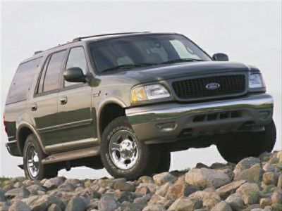 SUV with high ground clearance driving on rocky terrain