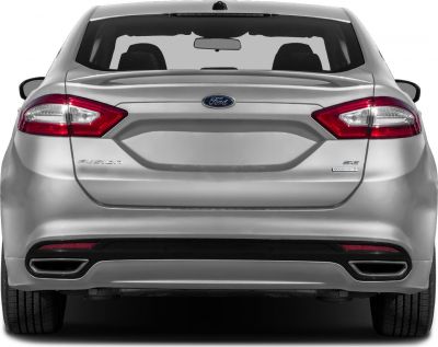 Rear view of a sedan with distinctive taillights and dual exhaust outlets