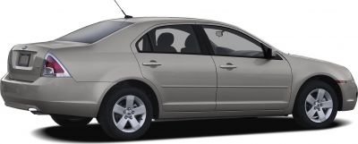 Side and rear view of mid-size sedan with alloy wheels and rear antenna