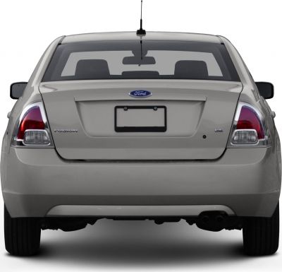 Rear view with distinctive taillights, rear windshield, and trunk.