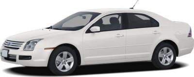 White sedan side profile with distinct front grille and alloy wheels