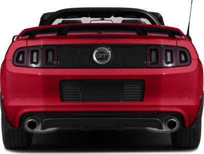 Rear close-up showing GT badge, taillights, dual exhaust on a convertible.