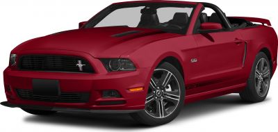 Red convertible sports car with aggressive front grille and open-top design