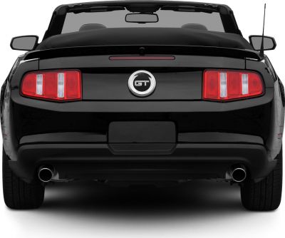 Rear view of a convertible with dual exhausts and distinctive tail lights