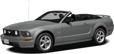 Convertible Mustang GT showcasing front and side profile in neutral tone.