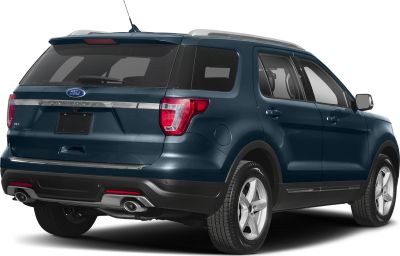 Rear view of SUV with dual exhaust and tinted windows