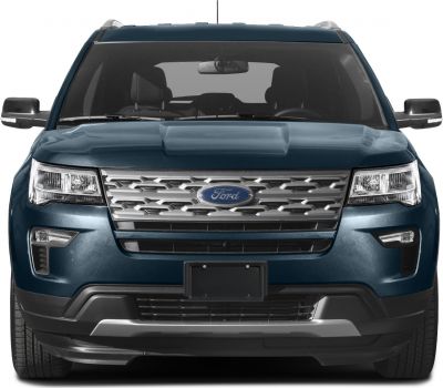 Front view with grille, headlights, and bumper of an SUV.