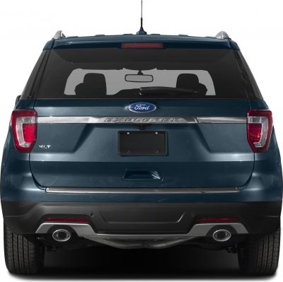 Rear view with dual exhausts, tail lights, and rear window silhouette
