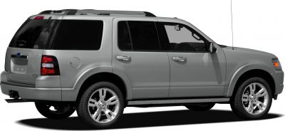 Side view of silver mid-size SUV with alloy wheels and roof rails