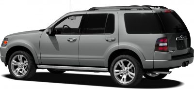 Side and rear view of SUV with tinted windows and chrome wheels