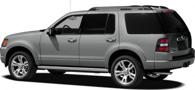 Side profile of SUV with chrome wheels and roof rails