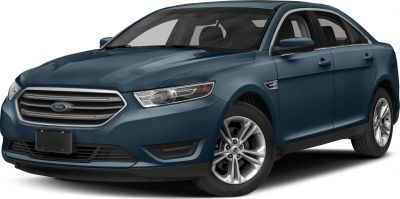 Front side view of mid-size sedan with prominent grille and headlight