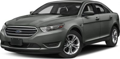 Front side view of a modern sedan with distinctive grille and headlights