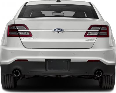 Rear view of sedan with distinctive tail lights and dual exhausts