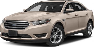 Front view with headlight, grille, and alloy wheel design
