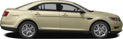 Side profile of a four-door car with alloy wheels