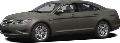 Side profile view of a sedan with chrome rims and sleek body design.