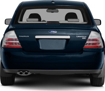 Rear view with dual exhaust and clear segmented tail lights
