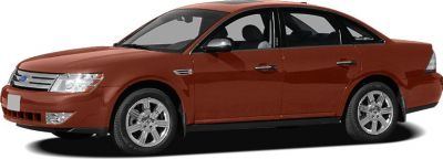 Side profile of a sedan with alloy wheels and four doors.