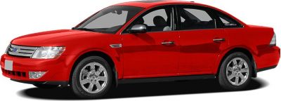 Red sedan side view with alloy wheels