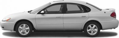 Side profile of a mid-size sedan with rear spoiler and alloy wheels