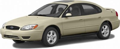 Beige sedan with rounded headlights and alloy wheels