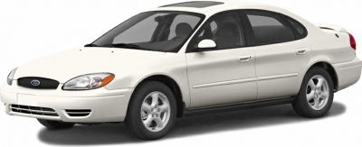 White four-door sedan with sunroof and alloy wheels