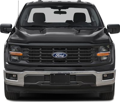 Front view of truck with black grille and dual-section headlights