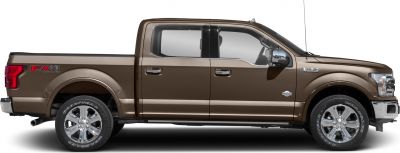 Side view of a crew cab pickup with chrome wheels and off-road FX4 decal