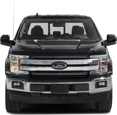 Front view of truck grille with chrome and headlights