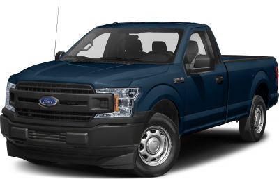 Front angled view of a pickup truck with steel wheels and bold grille