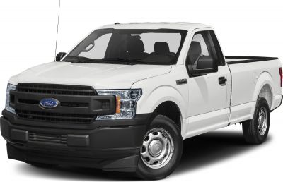 White pickup truck front angled view with black grille and steel wheels